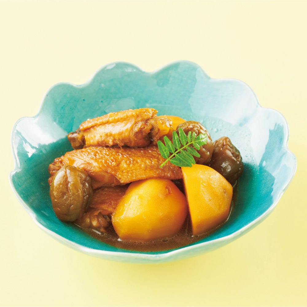 Simmered chicken wings and potatoes with plum